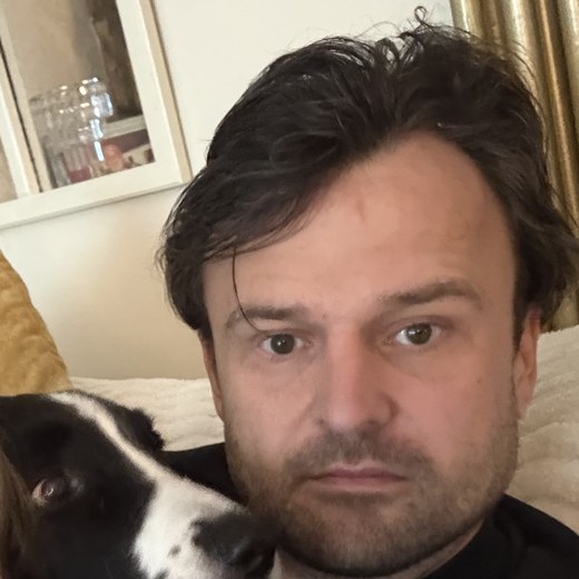 Matt, founder of Giddy Pets, at home with one of his dogs